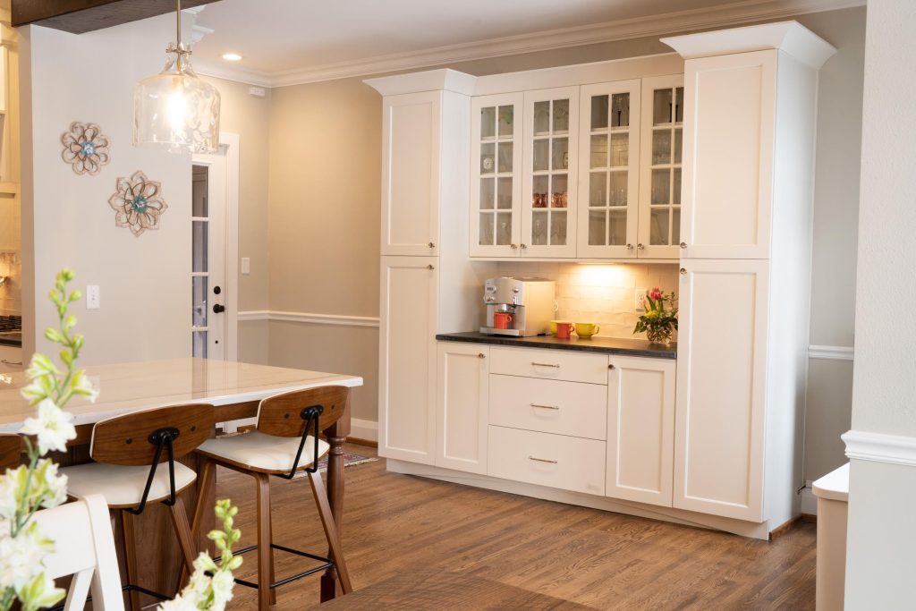 Built-in white kitchen cabinetry with glass doors installed by Old Orchard kitchen remodeler