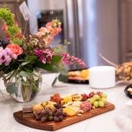 flowers and a meat and cheese board