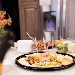 a cheeseball platter and veggies on a table at our class in sylvania ohio