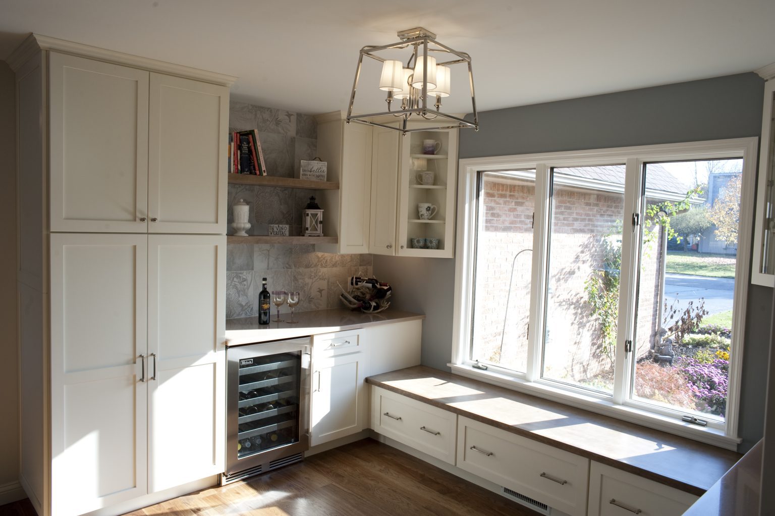 Recently renovated pantry area with window seat and cabinetry installed by Perrysburg home remodeler